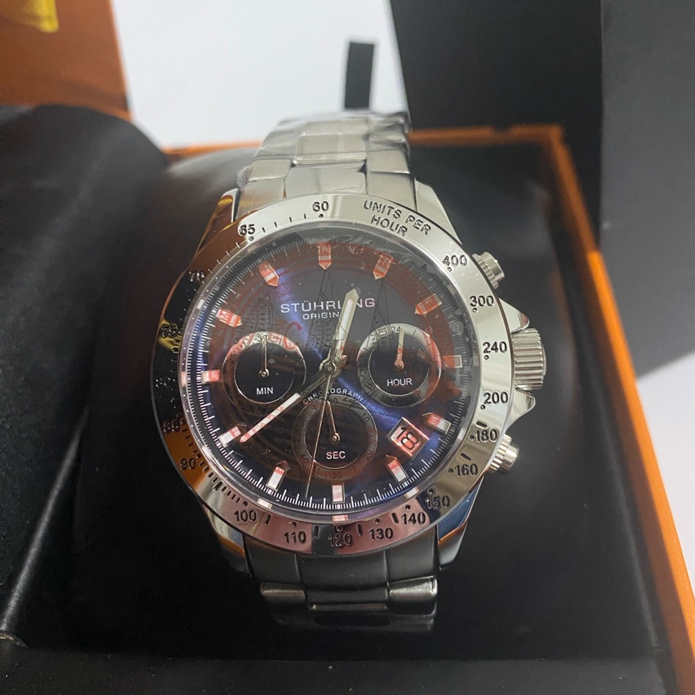 BRAND NEW Stuhrling watch. Silver band, blue face
